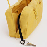 Open sunflower yellow bowler bag with zipper, interior pocket, and key clip