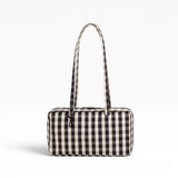 Black and cream gingham bowler bag with tall top handles and zip closure