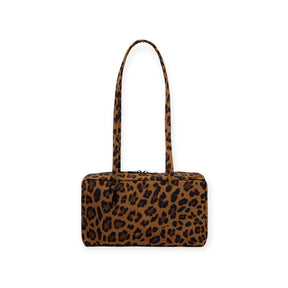 Leopard print Baggu nylon bowler bag with long straps and zipper closure on white background