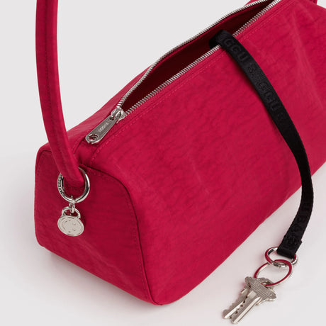 Cherry red nylon zip-top loaf bag detail with metal keyring and zipper pull