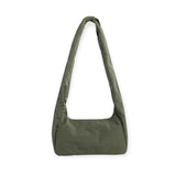 Olive green nylon hobo bag with wide opening and curved seam at front
