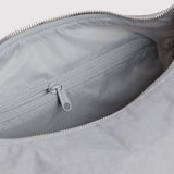 Nylon tote bag interior with zipper and fabric lining, gray zipper pull