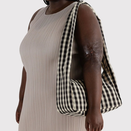 Black-and-cream gingham nylon hobo bag with long shoulder strap