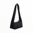 Black nylon tote bag with long handles and curved open top