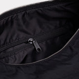 Black nylon bag interior with zip pocket and metal zipper pull