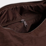 Nylon bag interior pocket with zipper, visible zipper pull