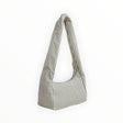 Baggu nylon meringue bag with sage green stripe fabric and gathered top handles