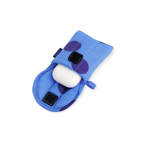 Blue puffy earbuds case with purple patches, holding white earbuds
