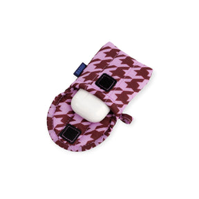 Puffy houndstooth earbuds case with white earbuds and black charging pads