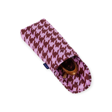 Puffy pink houndstooth glasses case, open with sunglasses inside