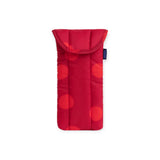 Red puffy glasses case with dark polka dots, top flap, and blue logo label