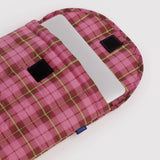Baggu puffy laptop sleeve, pink plaid interior with elastic strap and label detail