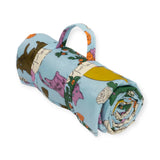 The Baggu Puffy Picnic Blanket - Table Cats combines both style and convenience with its handle, featuring vibrant cat illustrations and a floral pattern on a blue background. Enjoy your outdoor moments with this delightful blend of artistry and functionality from Baggu.