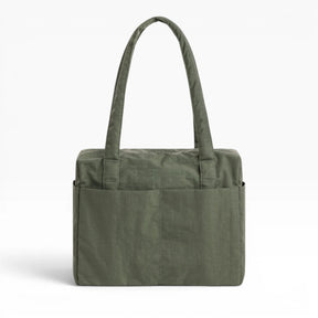 Baggu cloud carry-on tote bag in olive green with top handles and front zip pocket