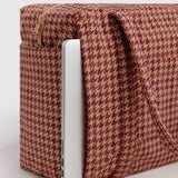 Houndstooth carry-on bag side view with zipper, tan and dark red pattern