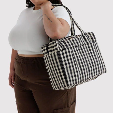 Baggu small carry-on tote bag, black-and-cream gingham, side view with handles