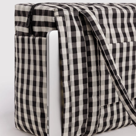 Baggu small carry-on bag in black-and-cream gingham, side panel and fastening strap