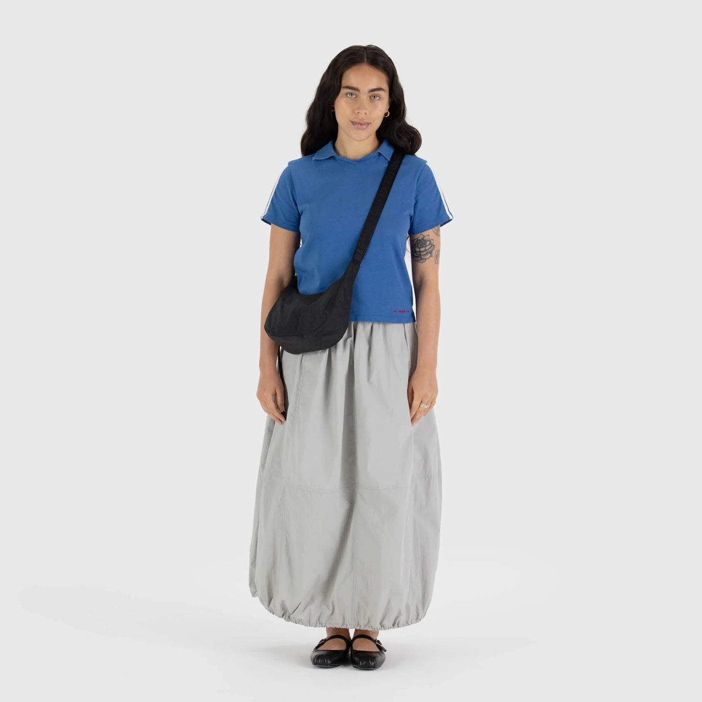 Black Baggu crescent crossbody bag with adjustable strap and long tie