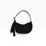 Black Baggu small nylon crescent bag with drawstring strap and dangling key tag