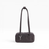 Small washed black denim bowler bag with arched handles and front top zipper