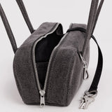 Washed black denim bowler bag with open top, black lining, dual zippers and key clip