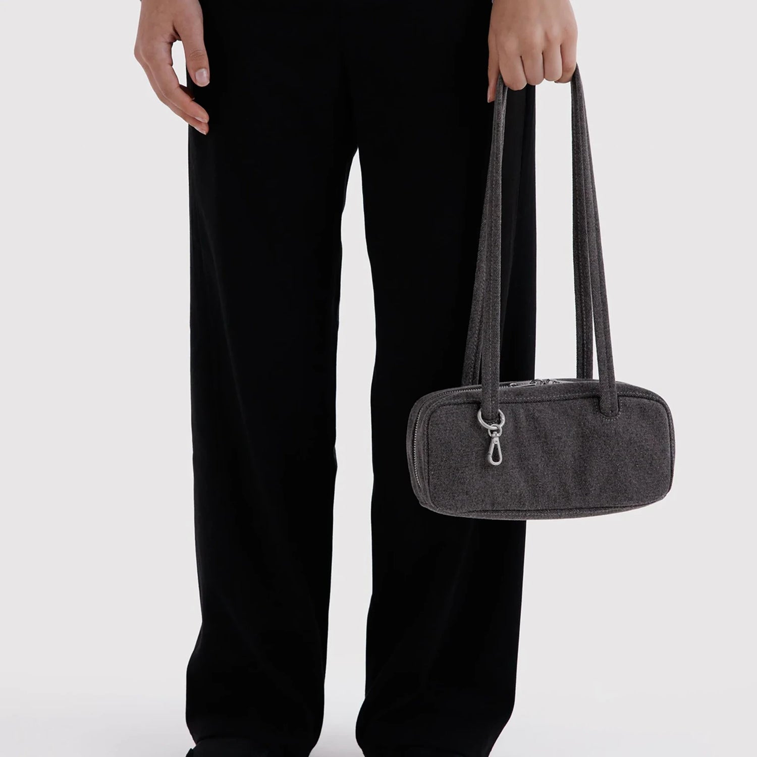 Small washed black denim bowler bag with top zipper and two short handles