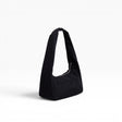 Black nylon meringue bag with wide base, curved handles, and open top tote.