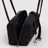 Small bowler bag in black with open top, dual zippers, and key clip.