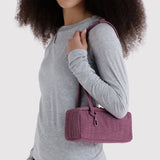 Small plum bowler bag carried on shoulder, two handles, zip closure