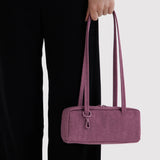 Small bowler bag in plum with two top handles and zip closure
