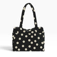 Polka-dot tote bag in black with cream dots, top handles, roomy open shape