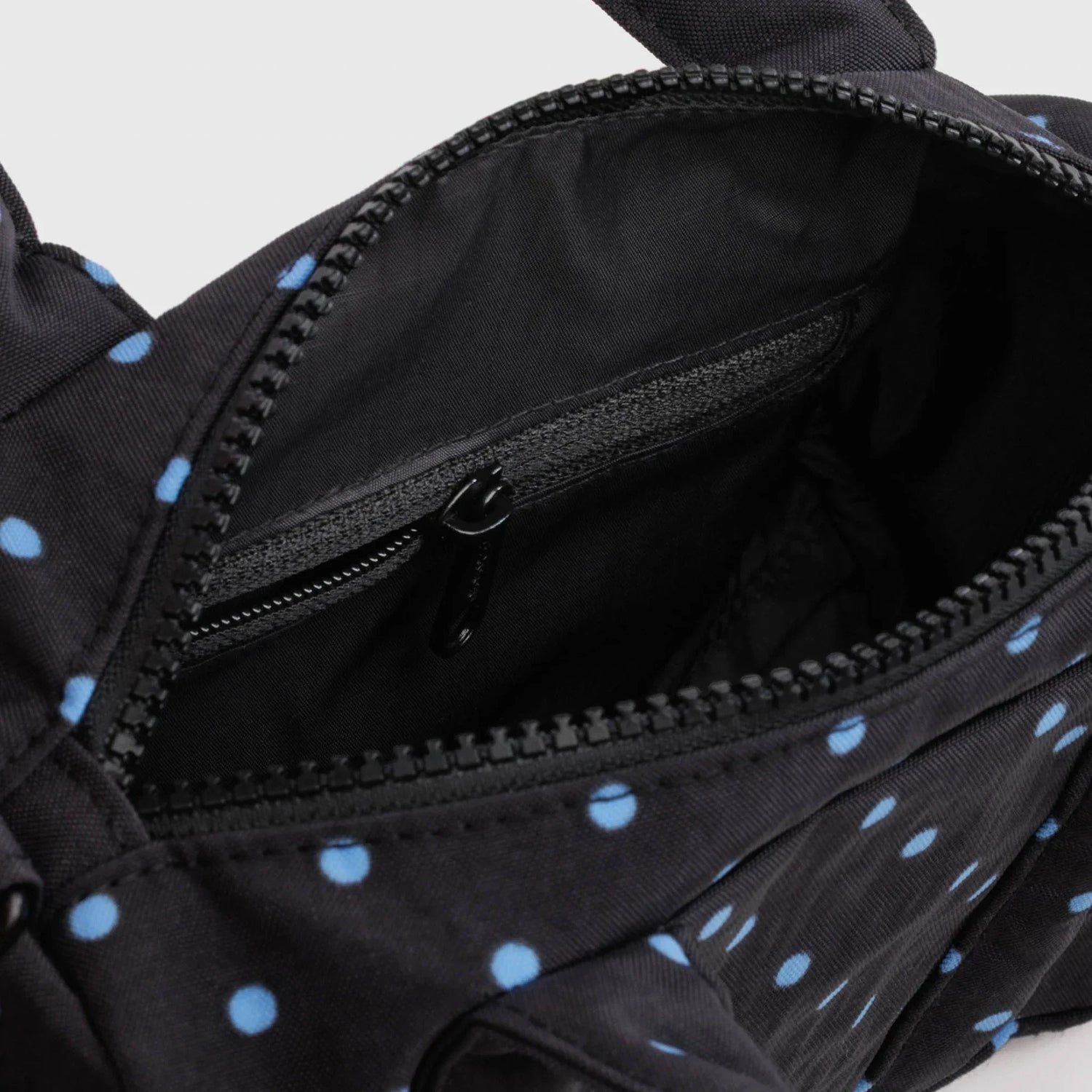 Black and sky blue micro dot small nylon duffle bag interior detail