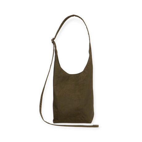 The Baggu Small Nylon Sling in Seaweed, with its simple rectangular design and adjustable strap, embodies sustainable style.