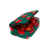 The Peanuts x Baggu - Snoopy Lunch Bag by Baggu is designed in green with a playful red character decoration, made from recycled polyester and insulated with PET polyfill. It’s perfectly sized to accommodate fresh tomatoes and red bell peppers.