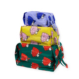 The Peanuts x Baggu Storage & Travel Set by Baggu includes three stacked rectangular bags in blue, yellow, and green. Made from recycled nylon, these bags feature a charming turtle pattern with drawstrings.