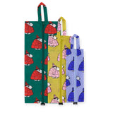 The Peanuts x Baggu Storage & Travel Set by Baggu includes three eco-friendly Snoopy Storage fabric bags in various sizes with charming penguin patterns in red, yellow, and blue. Each recycled nylon bag features a vertical zip and loop for hanging, perfect for travel organization.