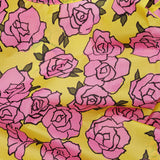 The Baggu Standard Reusable Bag - Rose by Baggu features a vibrant print of pink roses with green leaves.