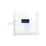 A compact white Baggu Standard Reusable Bag - Thank You Happy, made from recycled nylon, rests on a plain white background with a blue label prominently featured in the center.