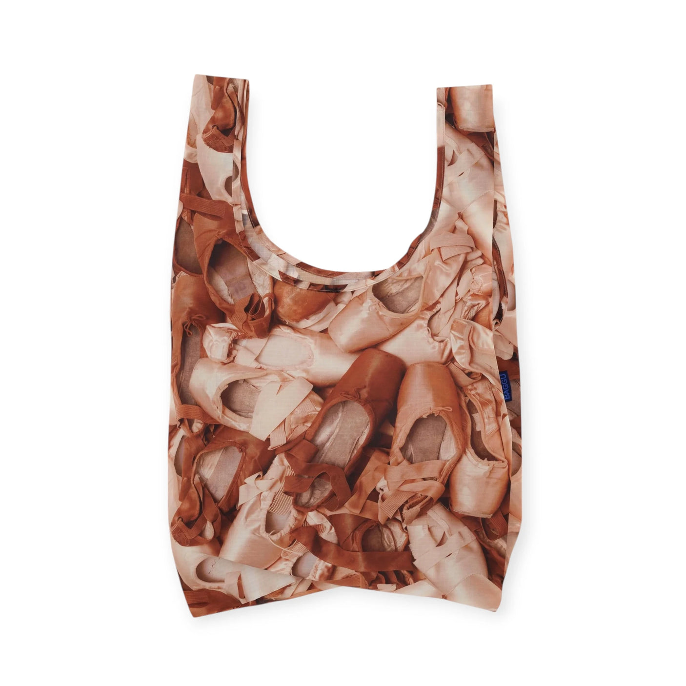 The Baggu Standard Reusable Bag - Pointe Shoe, by Baggu, is a ballet-inspired tote with a pattern of pointe shoes on a white background, ideal for eco-conscious style lovers.