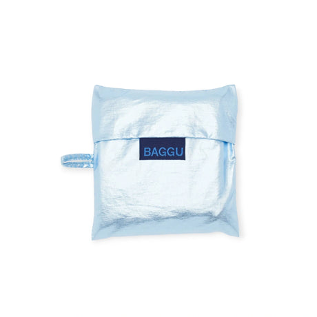 A Baggu Standard Reusable Bag in metallic light blue, made from recycled nylon, with a handy loop handle on the side.