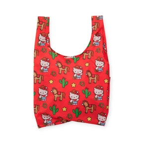 Bright red reusable Baggu bag with Hello Kitty in western outfit, horses, cacti, stars, and horseshoes pattern