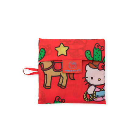 Compact red Hello Kitty x Baggu foldable bag with western cowgirl, cactus, horse, and star prints