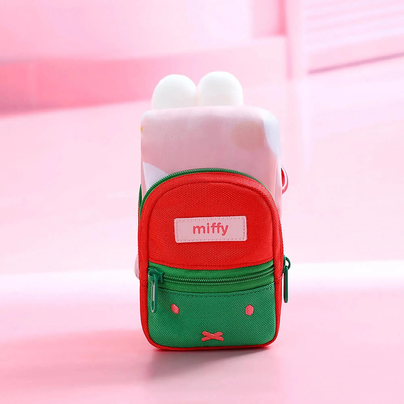 Plush mini backpack keychain with red-and-green front pocket and miffy logo