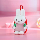 White Miffy plush keychain backpack with green and red straps and red loop