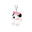 Fuzzy white plush keychain with black spots, pink bow, and metal key ring