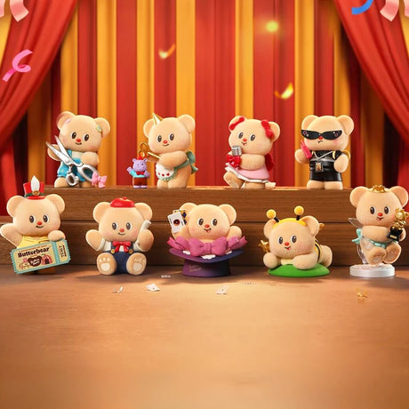 Nine small bear figurines with various accessories and costumes arranged on wooden surfaces against red and gold curtains backdrop