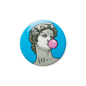 Button Badge Art - Michelangelo David by Today Is Art Day features Michelangelo's David blowing a pink bubble gum bubble on a round button, capturing the Button Badge Art style with a blue background.