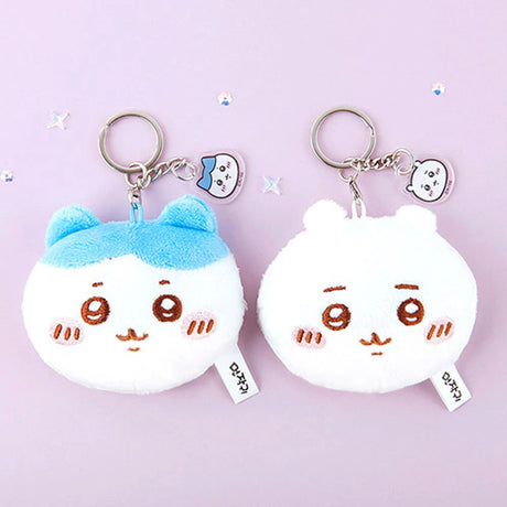 Two Chiikawa plush keychains with facial expressions and small character charms on pale purple background, promo image 2