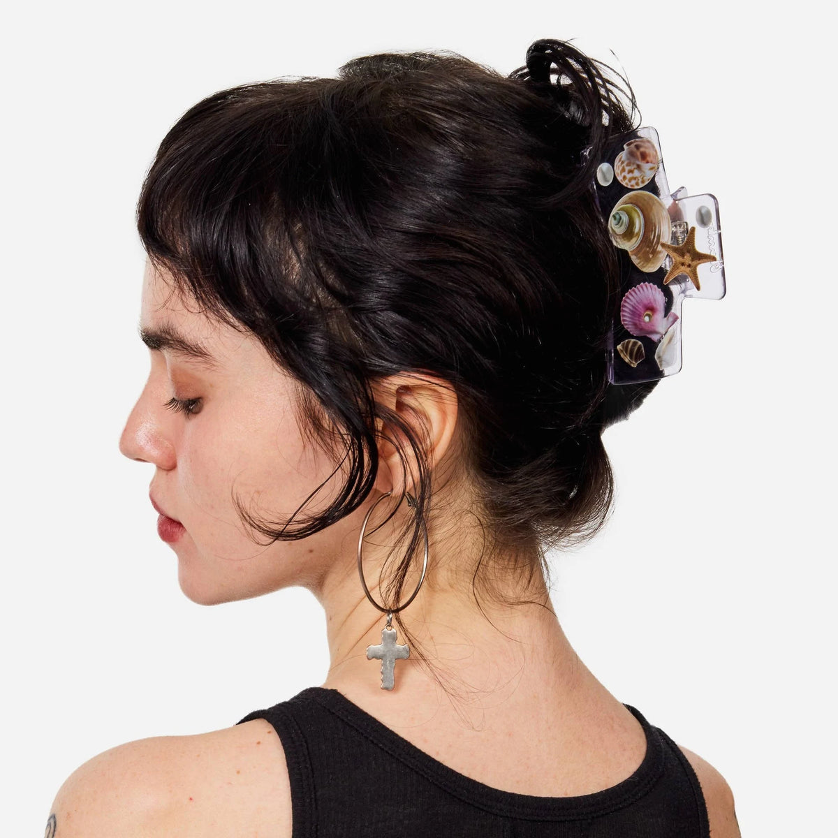 Seashell box claw clip worn on dark hair with shell and starfish charms