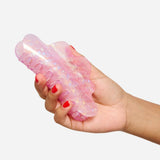 Iridescent lilac glitter claw hair clip held open, showing gripping teeth